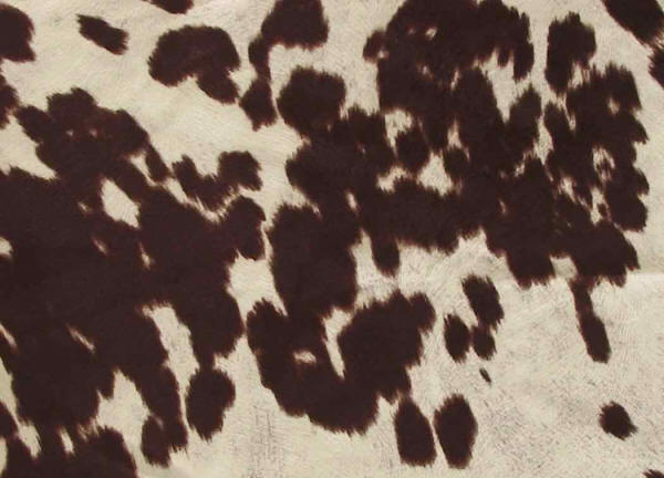 Brown and white faux cowhide upholstery fabric
